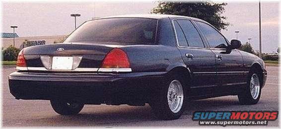 Dark sedan parked outside, rear view. Chrome trim on trunk and sides
