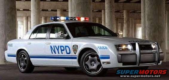 White NYPD police car with blue stripes, light bar, and push bumper. Front 3/4 view