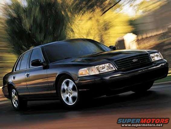 Black 1999 Ford Crown Victoria driving on a road