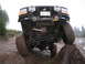 1989 Ford Bronco - This modified truck is navigating an obstacle on a wet, off-road course.