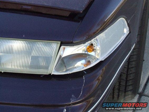 1992 Ford Crown Victoria front passenger side headlight assembly and grille detail