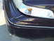 1992 Ford Crown Victoria - The front corner of a dark purple 1992 Ford Crown Victoria shows damage to the bumper and trim.