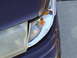 1992 Ford Crown Victoria - Close-up of the front headlight and turn signal assembly on a 1992 Ford Crown Victoria.