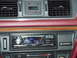 1992 Ford Crown Victoria - The dashboard of a 1992 Ford Crown Victoria shows an aftermarket stereo and digital clock.
