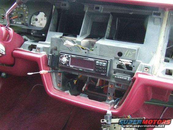 1992 Ford Crown Victoria dashboard with radio removed, showing wiring and HVAC vents
