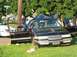 1999 Ford Crown Victoria - This 1999 Ford Crown Victoria sustained significant damage in an accident, with its windshield shattered and hood deformed.