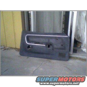 dark gray car door panel with silver trim