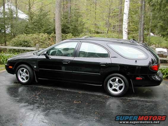 cars.jpg side view, the rear windows have recently been blacked out