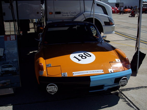 Orange and blue Porsche 914 with number 180 on hood, Hella headlights
