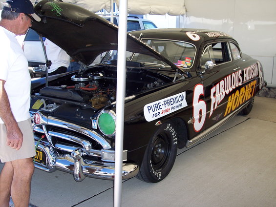 Black Hudson Hornet race car with number 6, "Fabulous Hudson Hornet" text, and "Pure-Premium" sticker