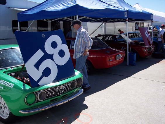 Green race car with hood open displaying number 58 and text 'BERGEN PRODUCTS'