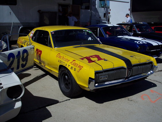Yellow 1969 Mercury Cougar race car with black stripes and number 79