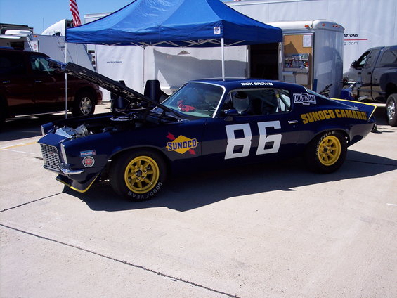 Dark blue race car with yellow wheels and number 86. "SUNOCO CAMARO" is written on the side