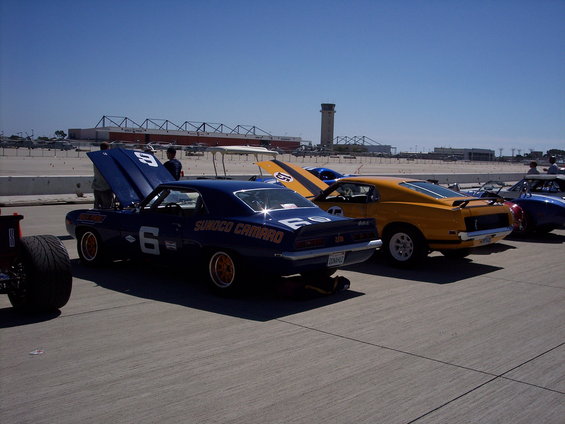 Blue 1969 Camaro race car with "Sunoco Camaro" text and number 6, parked on asphalt