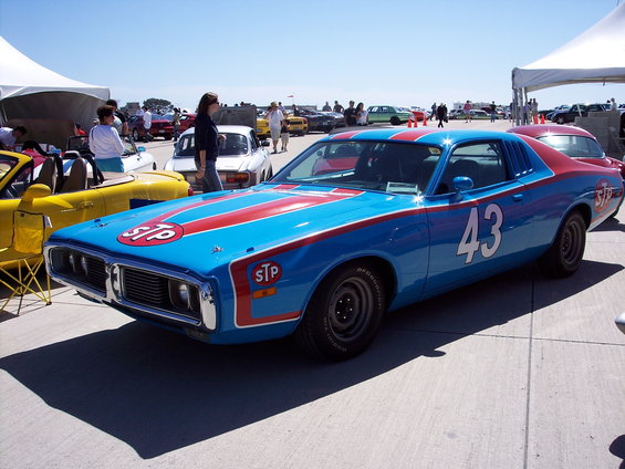 Blue and red race car with number 43 and STP logos