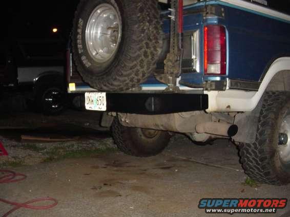 1985 Ford Bronco rear bumper with spare tire mounted above it. License plate reads UKW 650