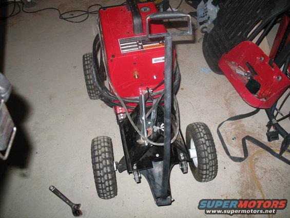 Red welding cart with black frame and wheels