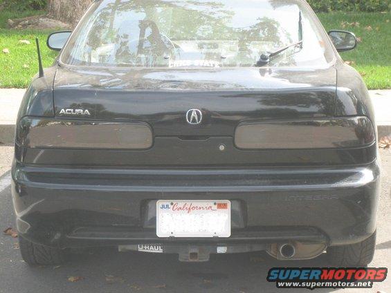 Black Acura Integra with California plates and a U-Haul hitch