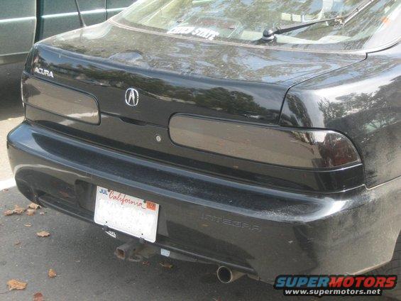 Black Acura Integra rear bumper with California license plate and trailer hitch