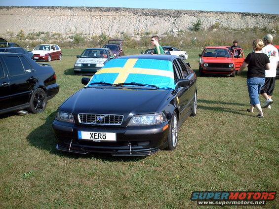 Black 2003 Volvo S40 with Swedish flag on windshield and custom license plate