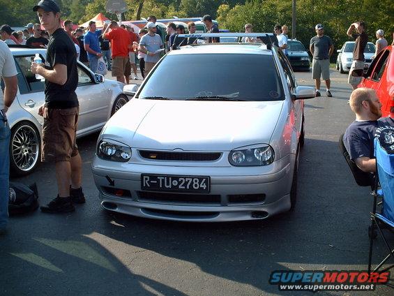 Silver VW Golf GTI with roof rack and custom bumper. License plate R-TU-2784