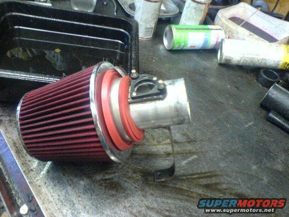 Red cone air filter with metal piping and red gaskets