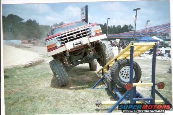 1995 Ford Bronco on obstacle course, 3q-front view, red