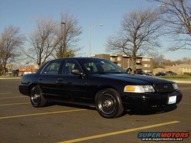 Black 2003 Ford Crown Victoria parked in a lot
