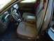 2003 Ford Crown Victoria - The interior of a 2003 Ford Crown Victoria, fabric seats and a dark dashboard.
