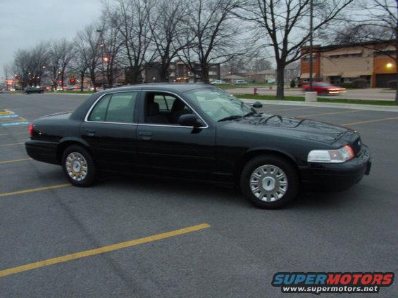 Black 2003 Ford Crown Victoria sedan, 3/4 front view