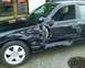 2003 Ford Crown Victoria - Driver's side of a black 2003 Ford Crown Victoria showing extensive collision damage.