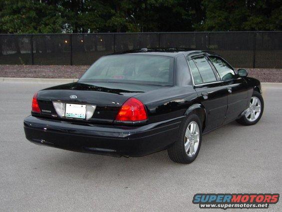 Black 2003 Ford Crown Victoria sedan, rear 3/4 view, clean condition