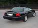 2003 Ford Crown Victoria - A black 2003 Ford Crown Victoria sedan is shown from the rear 3/4 angle.