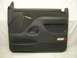 1993 Ford Bronco - This is a dark gray door panel, likely for a truck or SUV, a speaker grille and a reflector.