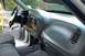 1997 Ford F-150 - The interior of a 1997 Ford F-150 is visible from the passenger side, including the dashboard and seats.