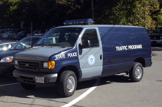 Ford E-Series van, blue and gray, marked STATE POLICE and TRAFFIC PROGRAMS