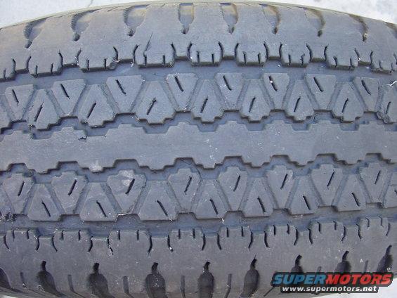 Tire tread with a geometric pattern and visible wear