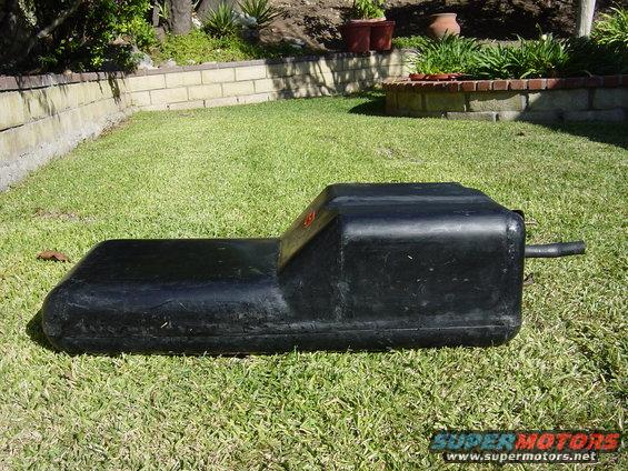Black fuel tank on grass