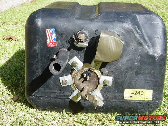 Black plastic fuel tank with metal sender unit, hose, and a "Made in U.S.A." sticker