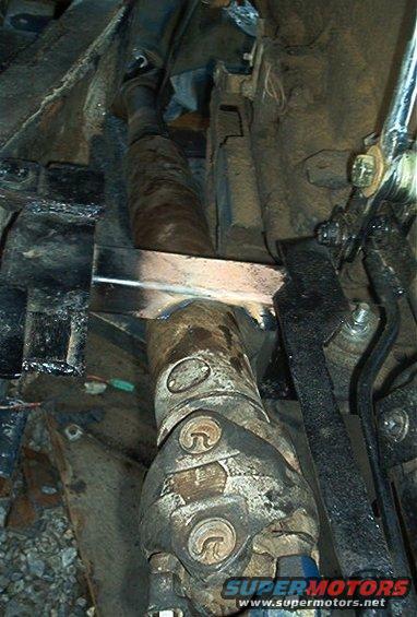 close-up of a driveshaft with a u-joint and some frame components