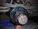 1995 Ford F-250 - Close-up of a vehicle's rear drum brake assembly, showing the hub and brake shoes.