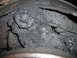 1995 Ford F-250 - This image shows a heavily soiled brake assembly, making year identification impossible.