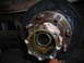 1995 Ford F-250 - A close-up view of a vehicle's wheel hub and brake drum assembly, showing signs of wear and tear.