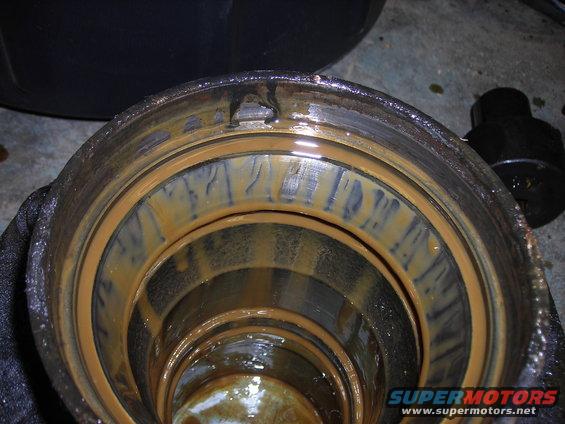 Close-up of a rusty differential housing interior with visible wear marks