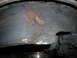 1995 Ford F-250 - Worn brake rotor and caliper assembly showing significant corrosion and wear.