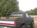 1989 Ford Bronco - Cab closed in and painted flat black Wooden thing is a dog box (kennel) for transporting dogs
