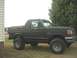1989 Ford Bronco - cab closed in and painted flat black wooden thing is a dog box (kennel) for transporting dogs