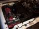 1992 Ford Ranger - Engine bay of a 1992 Ford Ranger, an aftermarket air intake and a Kirkland battery.