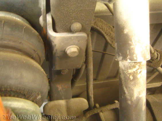 Truck suspension with air bag, shock absorber, and mounting bracket. Dusty condition