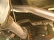 1994 Chevrolet Silverado 3500 - Underside view of a vehicle's suspension system, an exhaust pipe and an air spring.